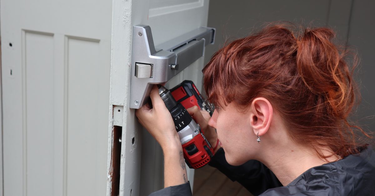 locksmith unlocking front door — Irvington Locksmith Pro